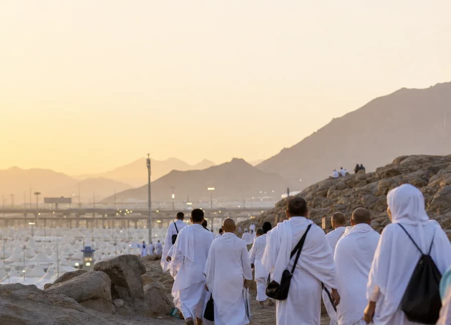 Pilgrims in Ihram overlooking Mina during the Hajj journey