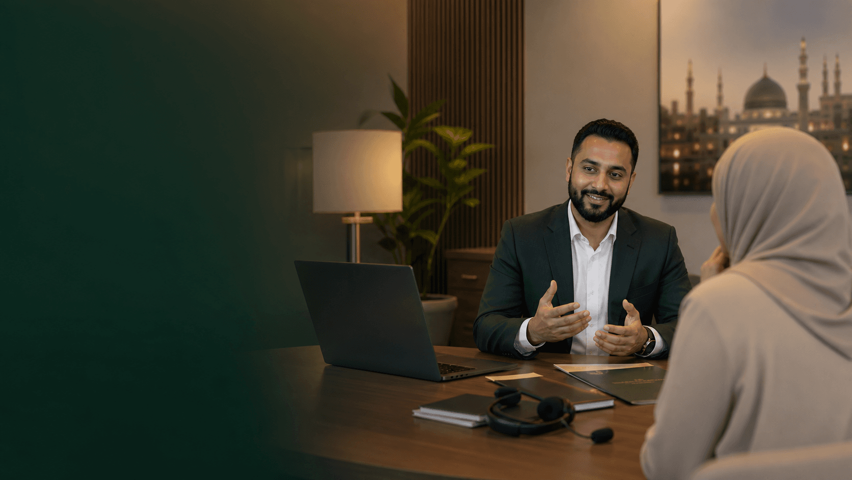 Travel consultant advising a customer at a warm office desk