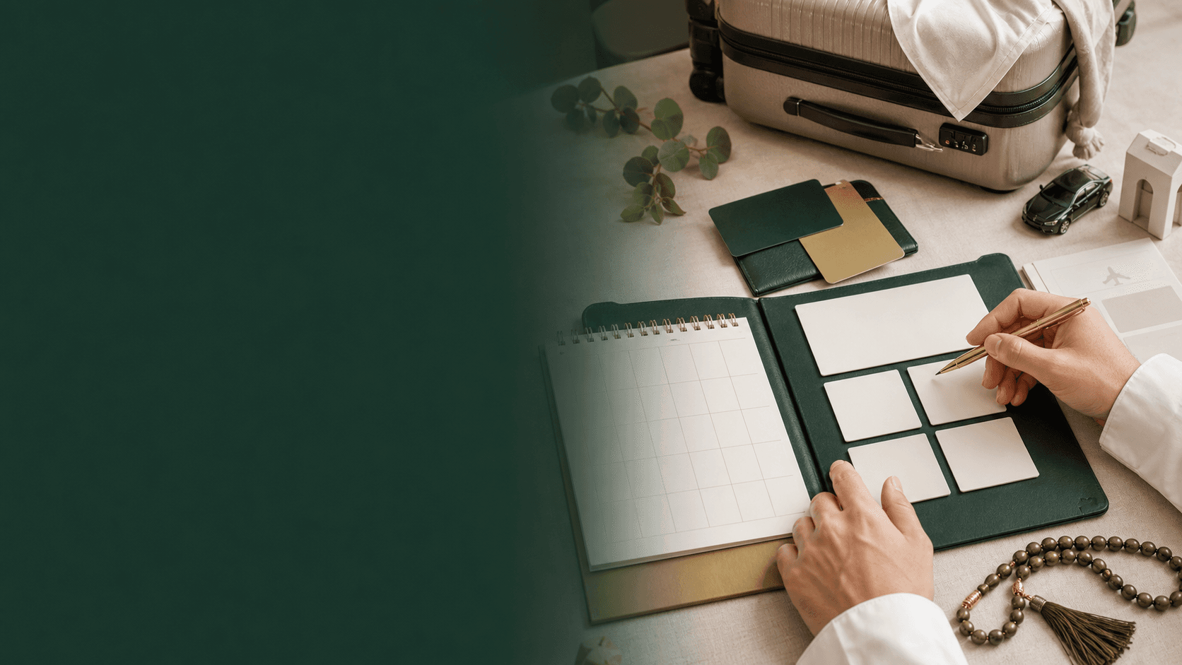 Custom Umrah planning materials arranged with luggage and travel documents