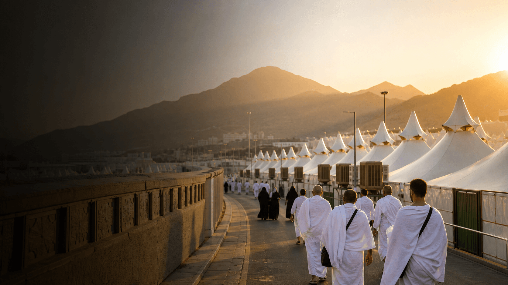 Pilgrims walking beside the Mina tent city during Hajj